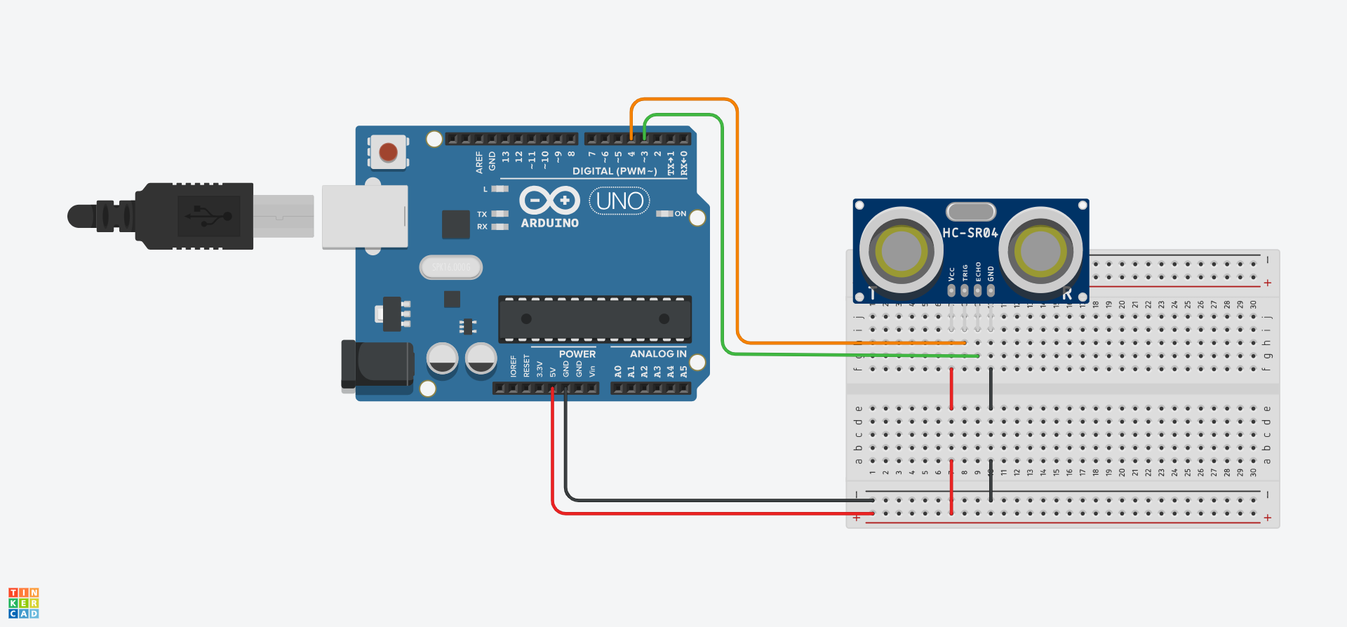 Cylched Tinkercad o'r diagram uchod gyda bwrdd bara wedi'i ychwanegu a'r synhwyrydd uwchsain wedi'i osod ynddo.
