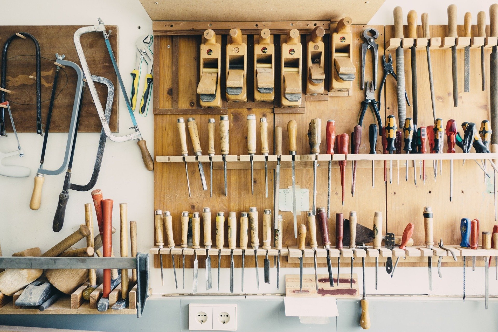A hanging wall of various hand tools